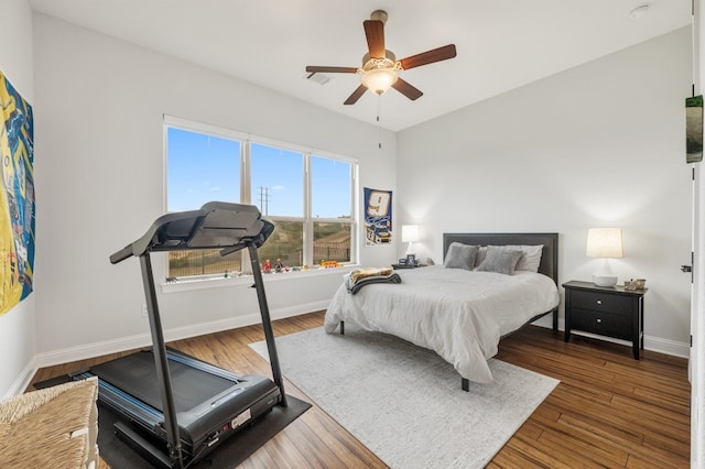 203 Serene Hilltop Cir, Lakeway, TX 78738 - bedroom with baseboards, wood finished floors, and a ceiling fan