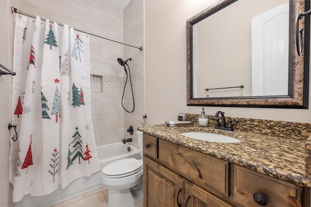 full bathroom featuring tile patterned flooring, shower / bath combo, vanity, and toilet