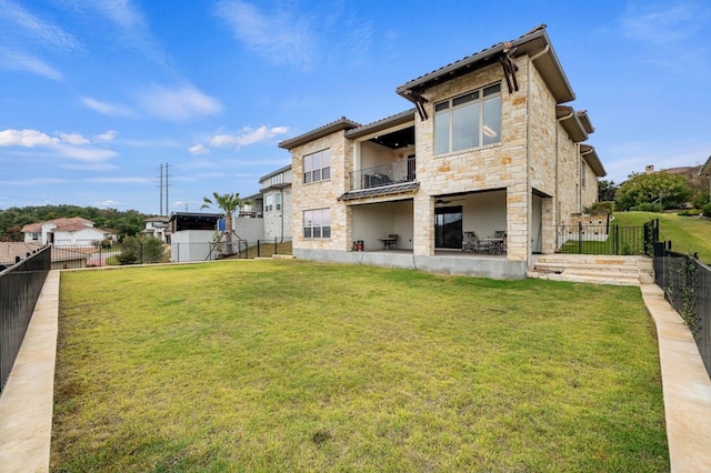 203 Serene Hilltop Cir, Lakeway, TX 78738 - rear view of house with stone siding and a balcony