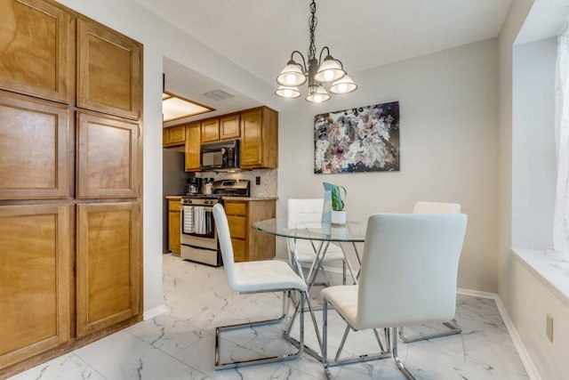 dining space featuring a chandelier