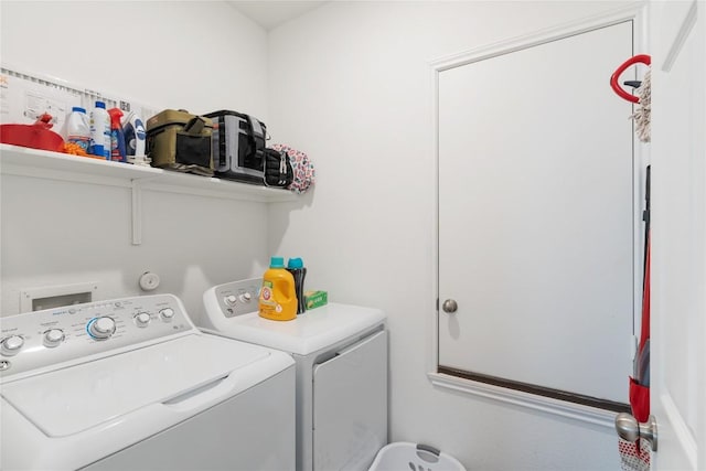 laundry area with independent washer and dryer