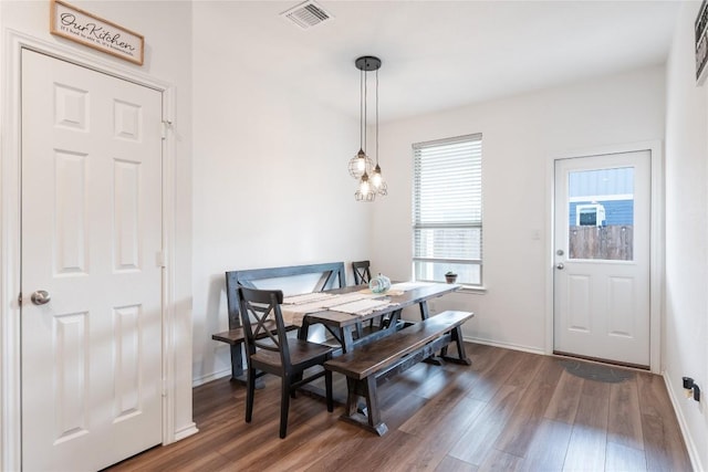 dining area featuring dark hardwood / wood-style flooring