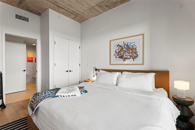 48 E Ave Unit 2506, Austin, TX 78701 - bedroom featuring wood finished floors and a closet