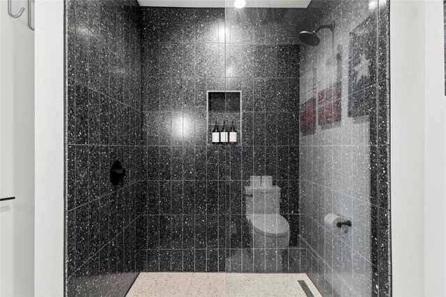 bathroom with a tile shower