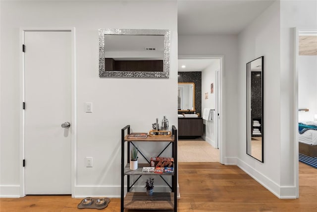 48 E Ave Unit 2506, Austin, TX 78701 - hall with wood finished floors and baseboards