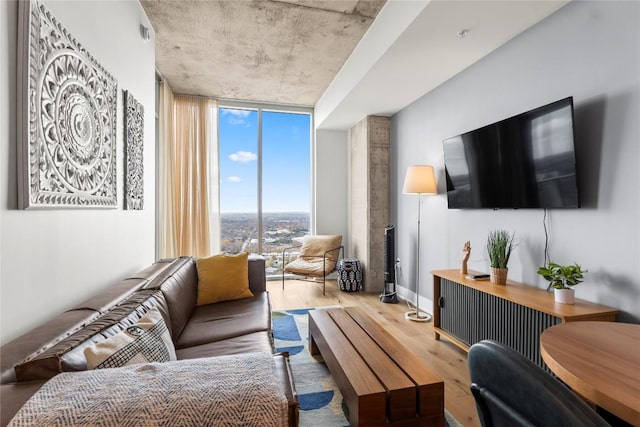 living room with hardwood / wood-style floors and expansive windows