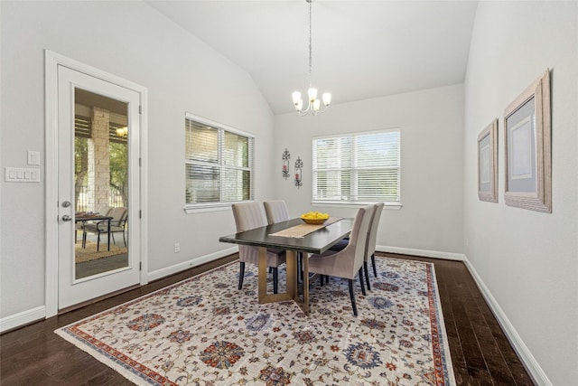 dining area with a chandelier, dark hardwood / wood-style flooring, and vaulted ceiling