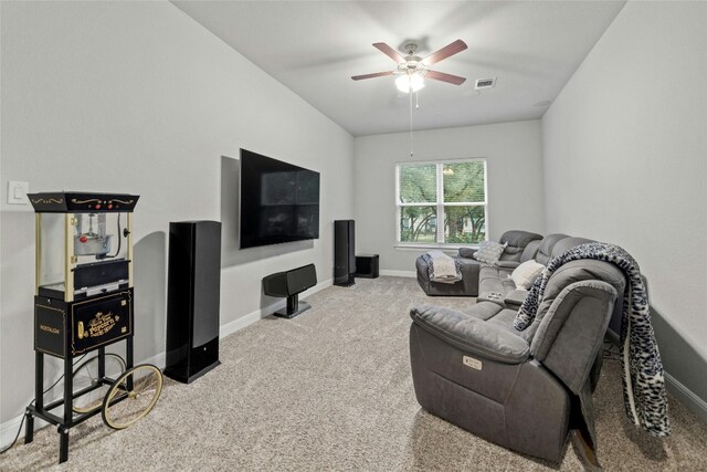 living room featuring carpet floors and ceiling fan