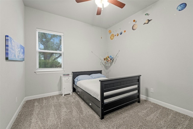 carpeted bedroom featuring ceiling fan