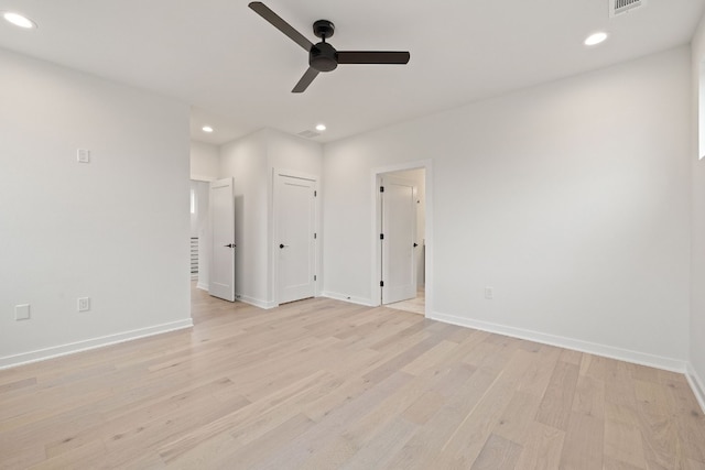 spare room with ceiling fan and light hardwood / wood-style flooring