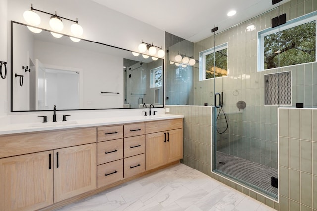 bathroom featuring vanity and an enclosed shower