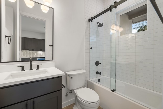 full bathroom with combined bath / shower with glass door, decorative backsplash, vanity, and toilet