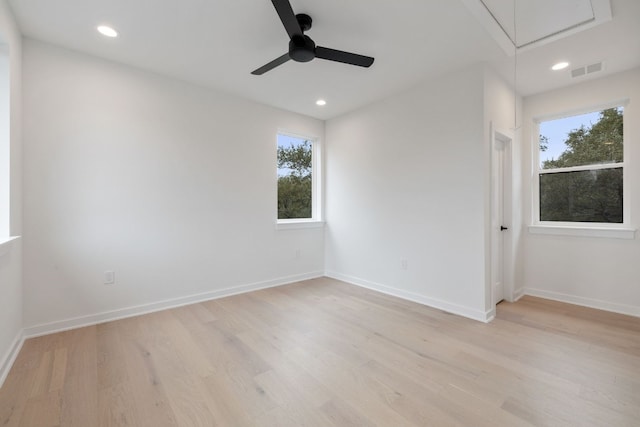 spare room with ceiling fan and light hardwood / wood-style flooring