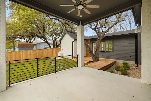 view of patio / terrace with ceiling fan and a deck