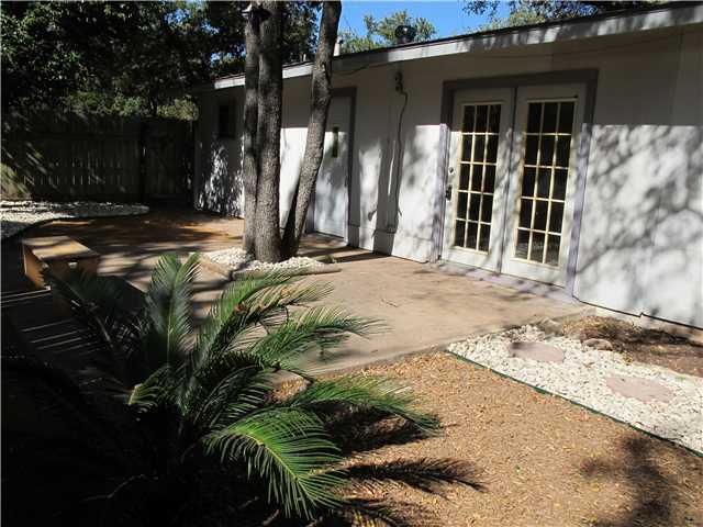 view of exterior entry featuring a patio area and french doors