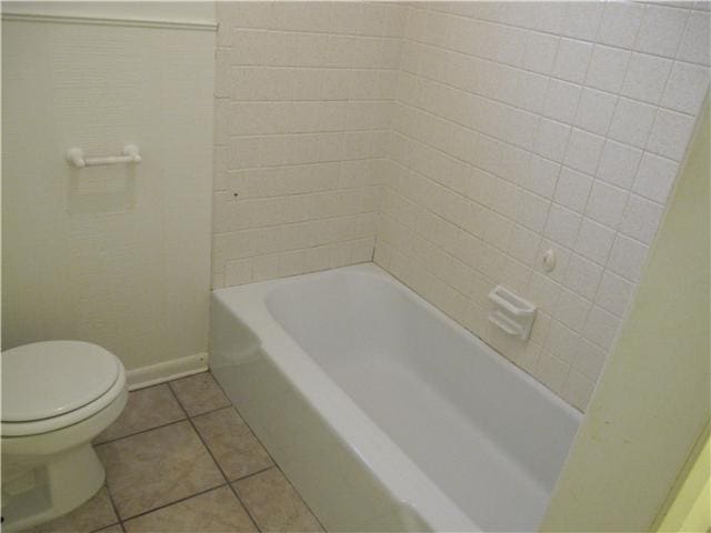 bathroom featuring tile patterned flooring and toilet