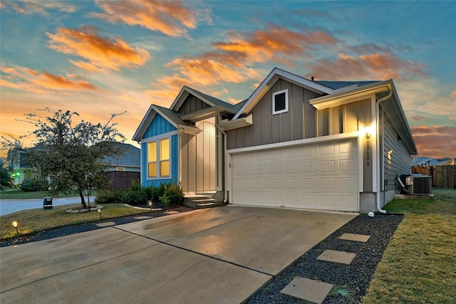 view of front of property featuring central AC unit and a lawn