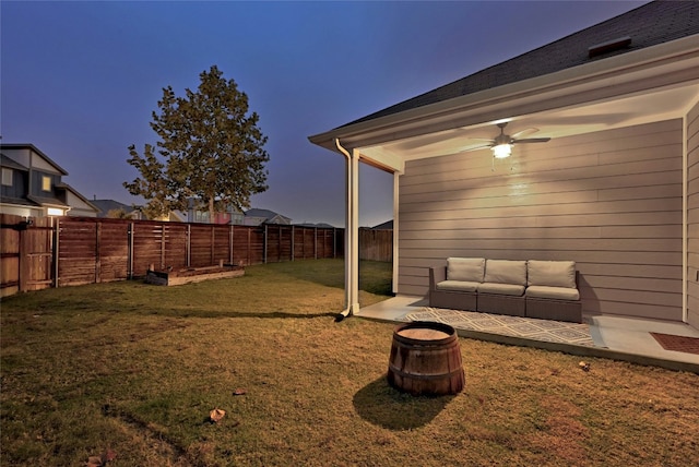 yard at dusk with ceiling fan