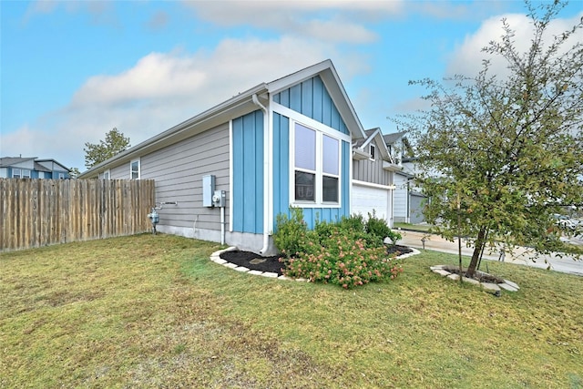 view of property exterior with a lawn