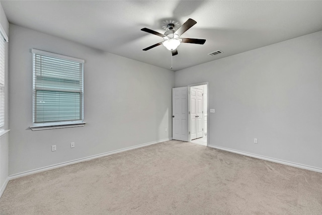 carpeted empty room with ceiling fan