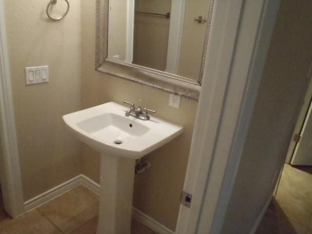 bathroom with tile patterned flooring and sink