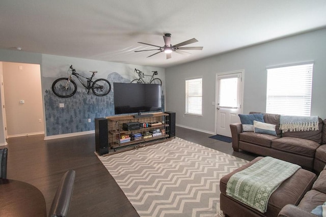 living room with ceiling fan and wood-type flooring