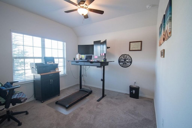 exercise room with ceiling fan, plenty of natural light, light colored carpet, and lofted ceiling