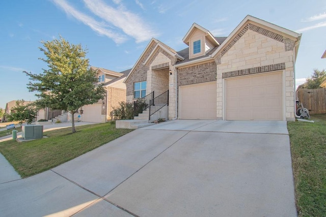 view of front of home featuring a garage and a front yard