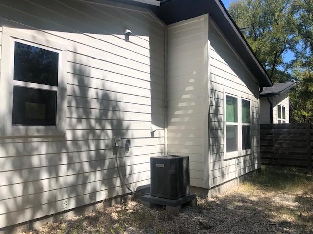 view of side of property featuring cooling unit