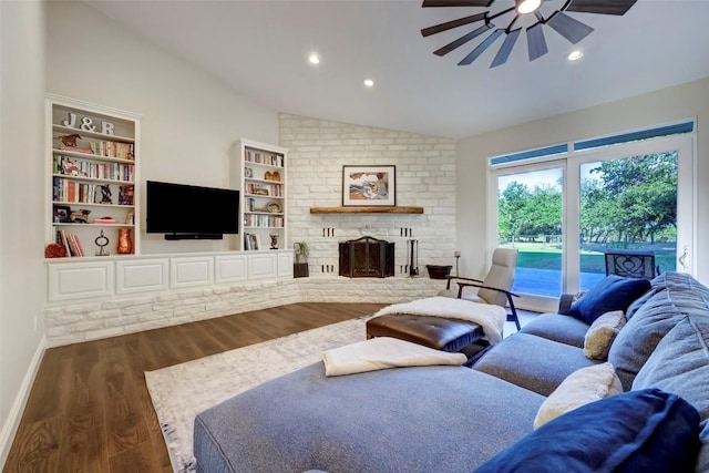 living room featuring a brick fireplace, ceiling fan, dark wood-type flooring, and vaulted ceiling