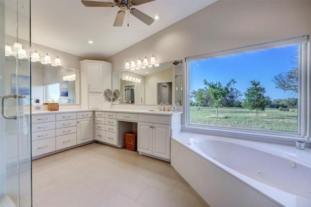 bathroom with separate shower and tub, ceiling fan, vanity, and vaulted ceiling