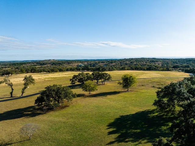 birds eye view of property with a rural view