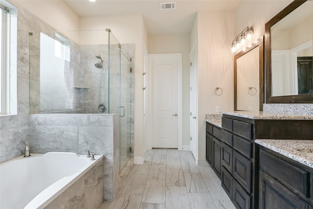 bathroom with vanity and plus walk in shower