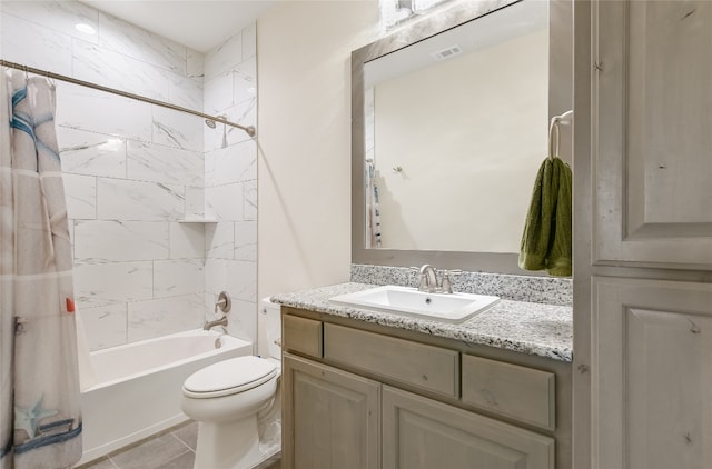 full bathroom with tile patterned floors, vanity, toilet, and shower / tub combo