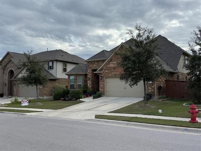 view of front of property with a front lawn and a garage