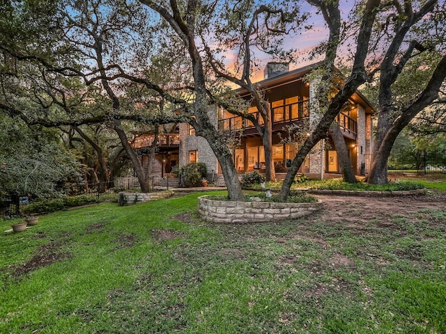 3901 Prentice Ln, Austin, TX 78746 - view of front of house with stone siding and a chimney