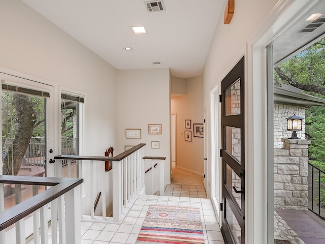 3901 Prentice Ln, Austin, TX 78746 - corridor with an upstairs landing and light tile patterned flooring