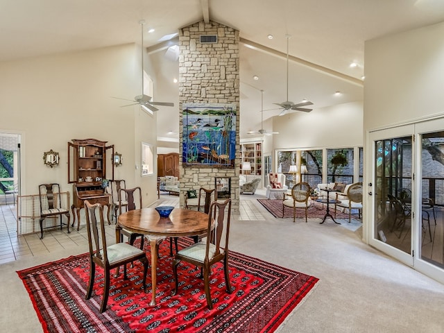 3901 Prentice Ln, Austin, TX 78746 - dining room with ceiling fan, high vaulted ceiling, light colored carpet, a stone fireplace, and beam ceiling
