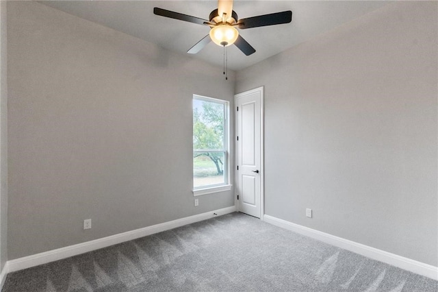 carpeted empty room with ceiling fan