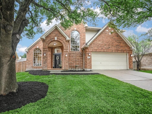 front facade featuring a garage and a front yard