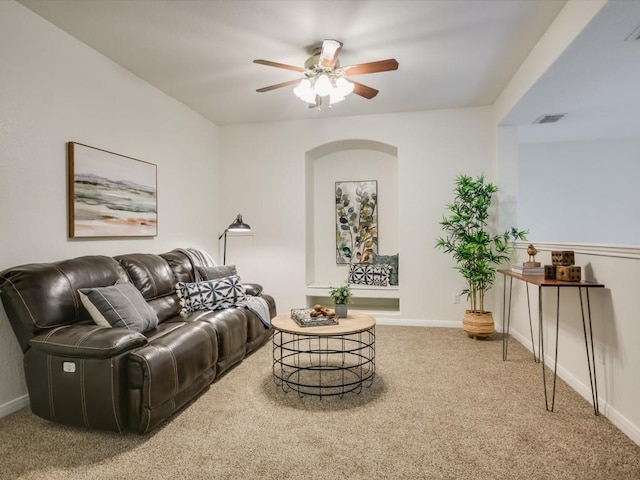 living room with carpet flooring and ceiling fan