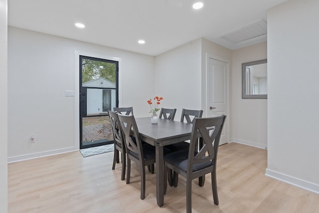 dining space featuring light wood-type flooring