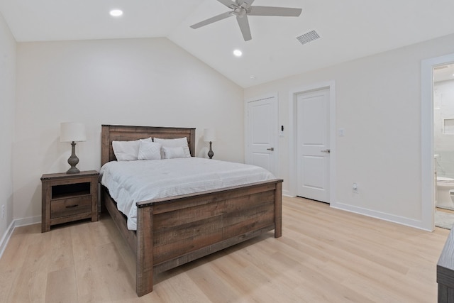 bedroom with ensuite bathroom, ceiling fan, lofted ceiling, and light hardwood / wood-style floors