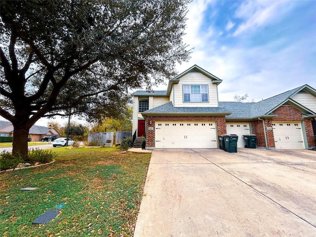 front facade with a front yard and a garage