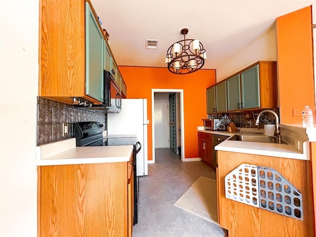 kitchen featuring black appliances, tasteful backsplash, sink, and concrete floors