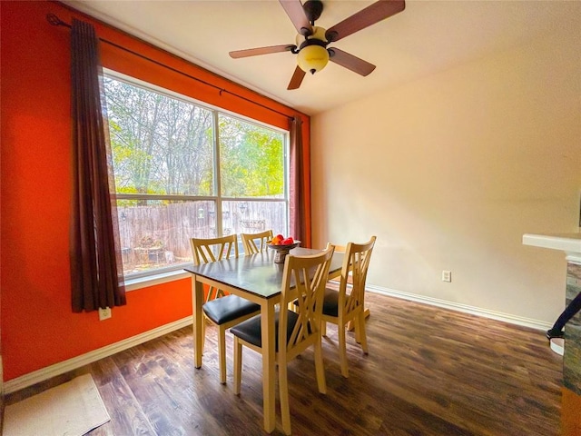 dining area featuring ceiling fan and dark hardwood / wood-style flooring