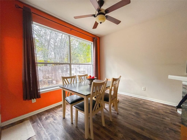 dining space with dark hardwood / wood-style floors and ceiling fan