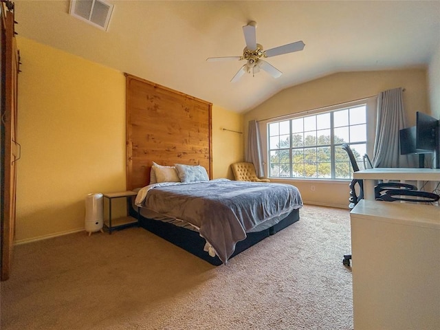 carpeted bedroom featuring ceiling fan and lofted ceiling