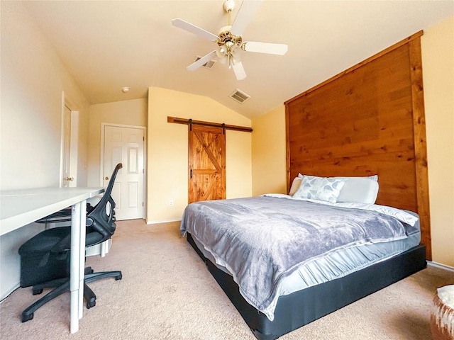 carpeted bedroom featuring a barn door, ceiling fan, and lofted ceiling