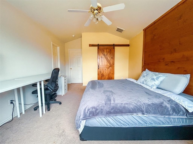 bedroom with light carpet, a barn door, vaulted ceiling, and ceiling fan